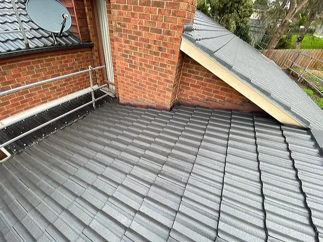 Restored tiled roof in Carrum Downs showing clean, freshly coated tiles and watertight finish.