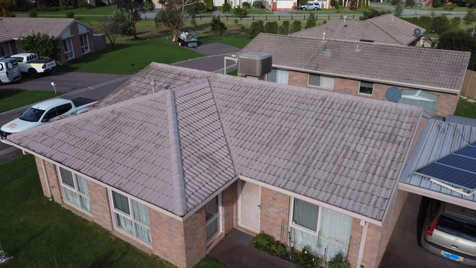 Sure! Here’s how I would rewrite the alt text for a Top Glaze Roofing Systems location page (let’s use the example suburb “Glen Waverley” in Melbourne): Rewritten Alt Text: Aerial view of a single-story brick home in Glen Waverley with a tiled roof, recently serviced by Top Glaze Roofing Systems; features large windows, a tidy front garden, and nearby similarly styled houses—roof repairs and restoration available for local tile, metal, and Colorbond roofs. Swap out “Glen Waverley” for whichever suburb you need on other location pages. Let me know if you want an example for metal or Colorbond roof!.