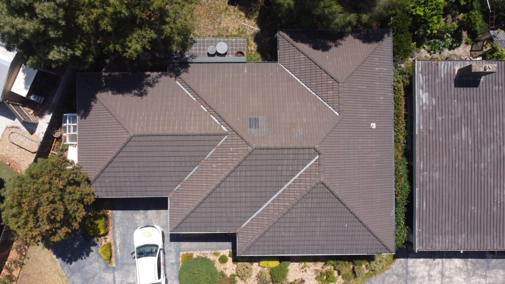 Tile roof repair in Frankston addressing cracked and displaced tiles.