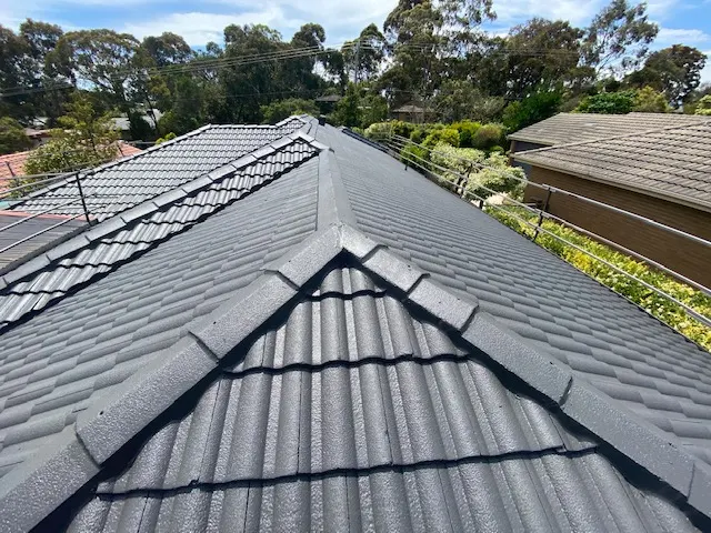 Freshly repaired tile roof in Werribee featuring dark grey tiles and clean ridge lines.