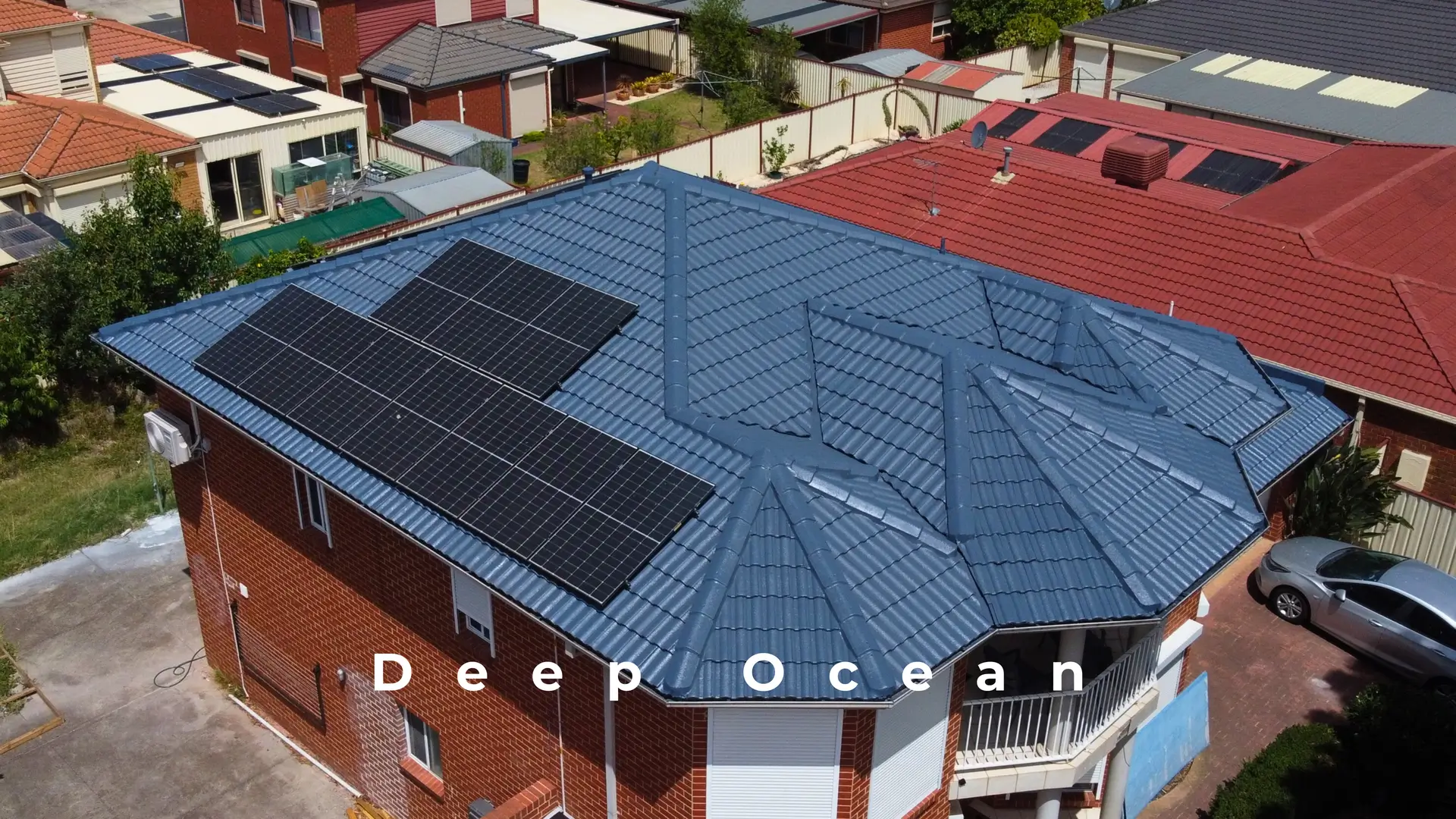 Aerial view of Melbourne roof repair, Deep Ocean tiles, solar panels.
